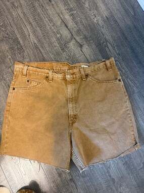 Vintage Levi's 550 Relaxed Fit Cut-Off Denim Shorts in Brown